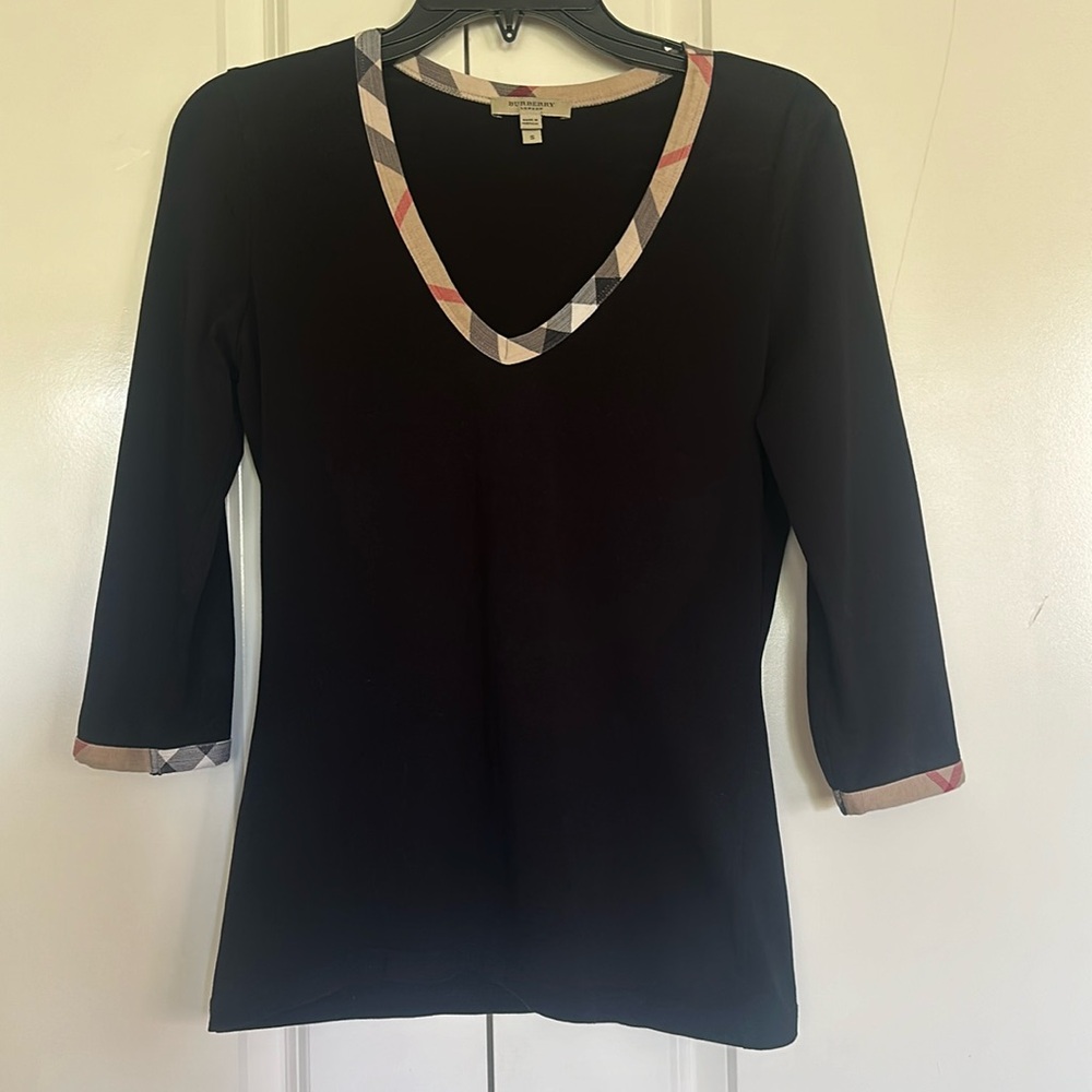 Style is Fitted & 3/4 sleeves. Collar  & sleeves trim Burberry design.